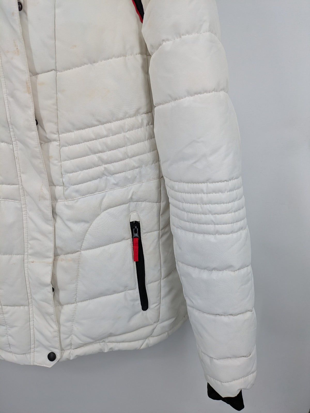 Janina white puffer jacket with quilted design and faux fur hood accents.