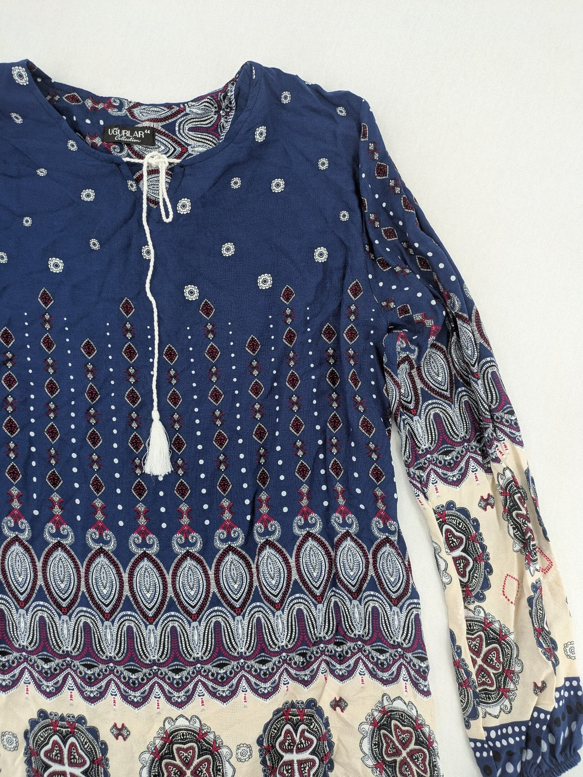 Uğurlar Collection multi tunic dress with vibrant Boho-Ethno pattern and V-neck tassel detail.
