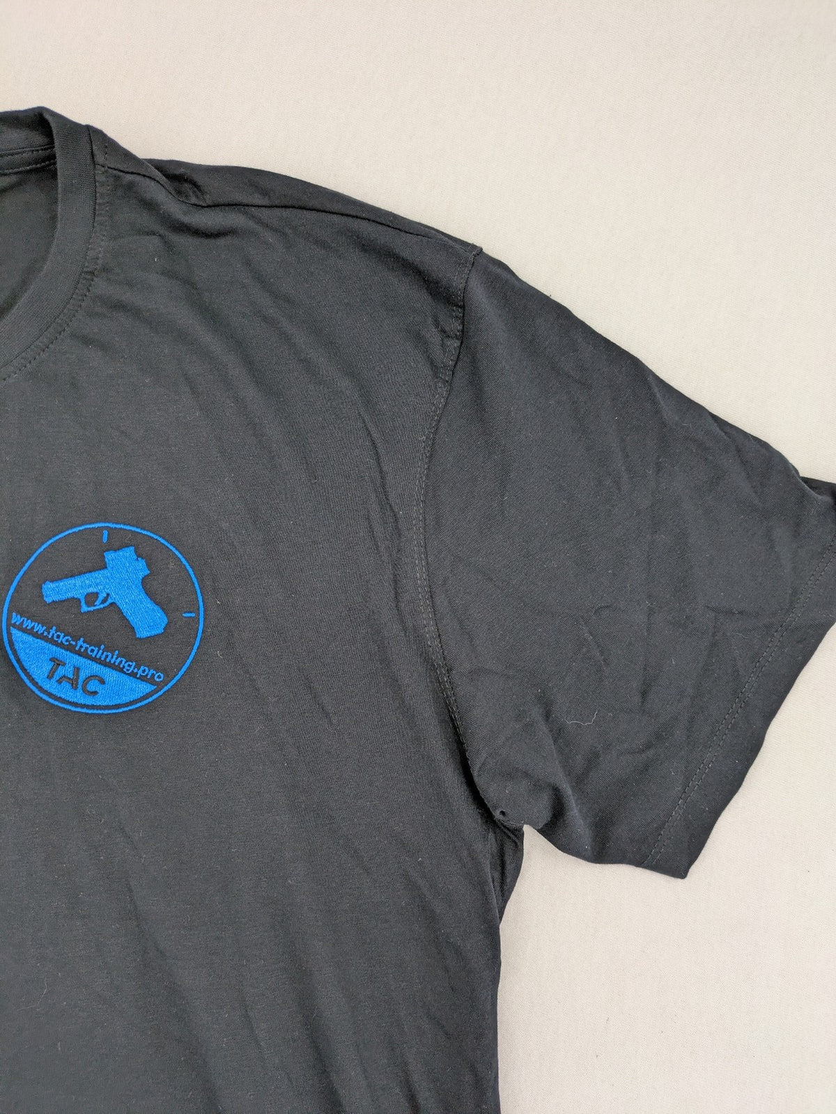 HAKRO blue and grey T-shirt with embroidered TAC Training logo on chest.