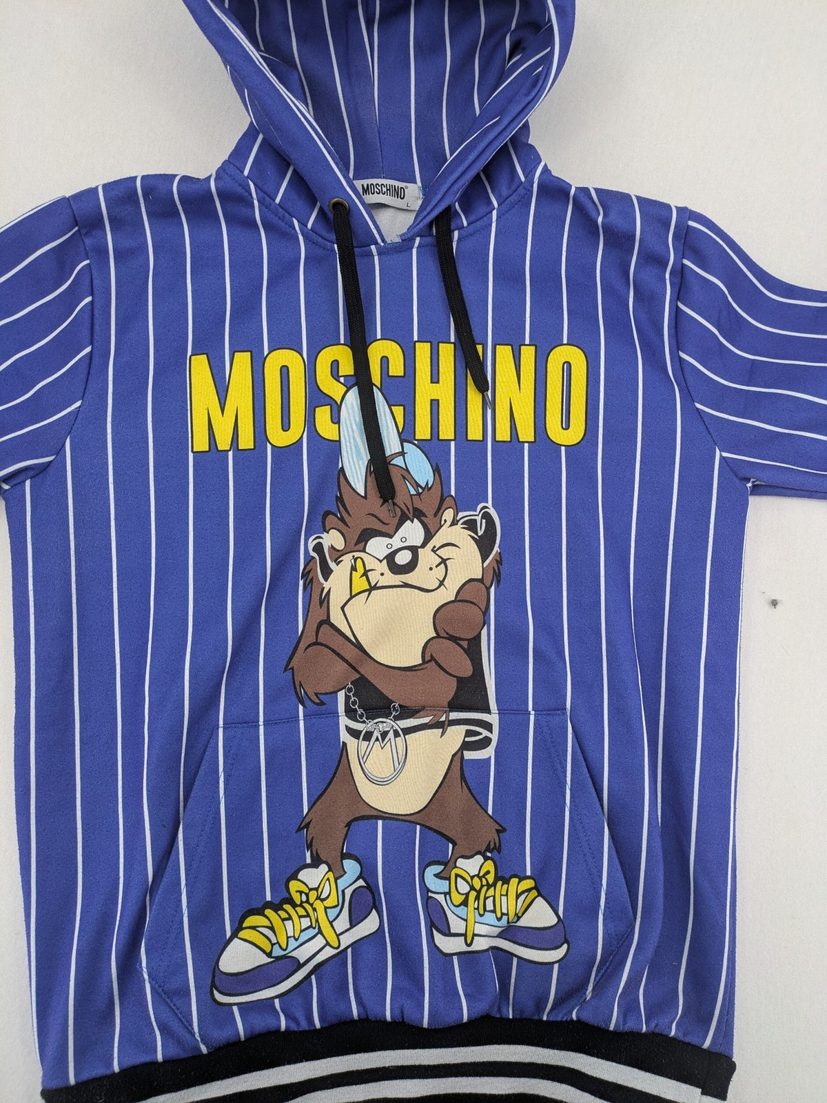 Moschino multi turtle neck jumper blue and white striped with Tasmanian Devil graphic.