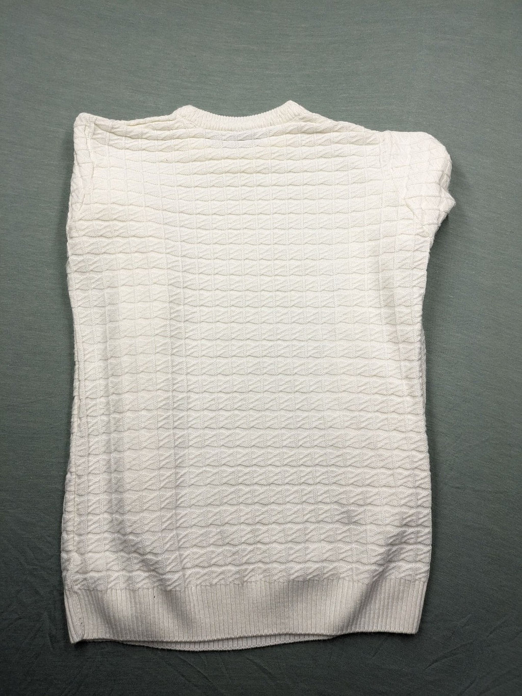 Haskalkan white turtle neck jumper with geometric textured pattern and ribbed cuffs.