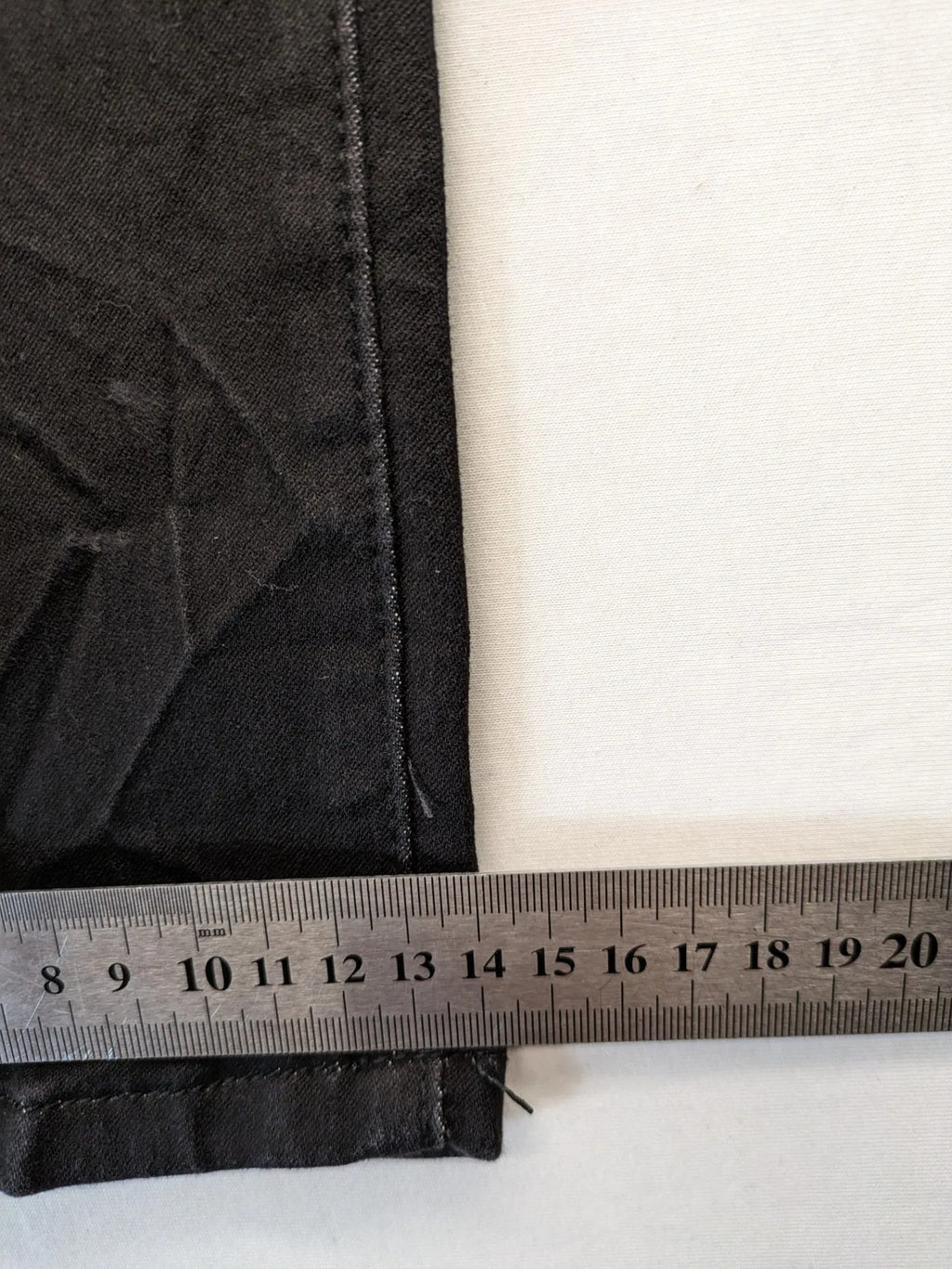 L & K Kaha black straight jeans with rhinestone logo patch and classic 5-pocket design.