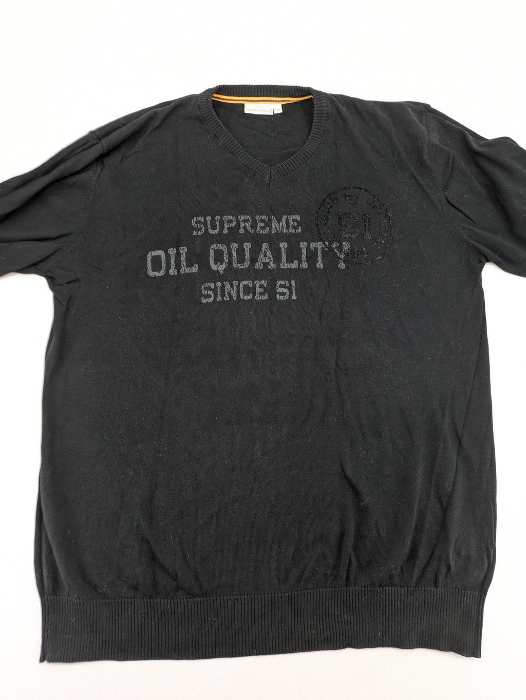 Angelo Litrico black knit jumper V-neck with tonal emblem and "Supreme Oil Quality" graphic.