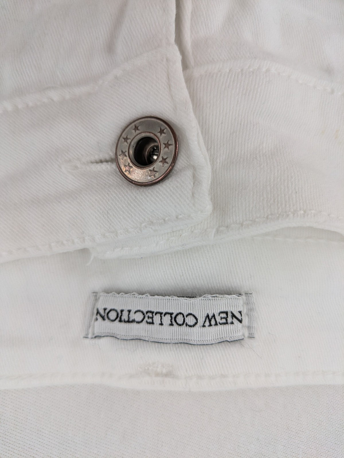 New Collection white straight jeans asymmetrical wrap design with side lacing and cotton-stretch material.