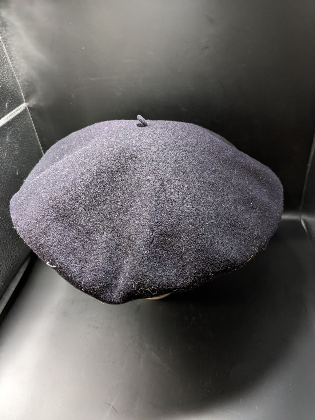 Luxe navy beret pure wool waterproof with emblem lining and leather band.