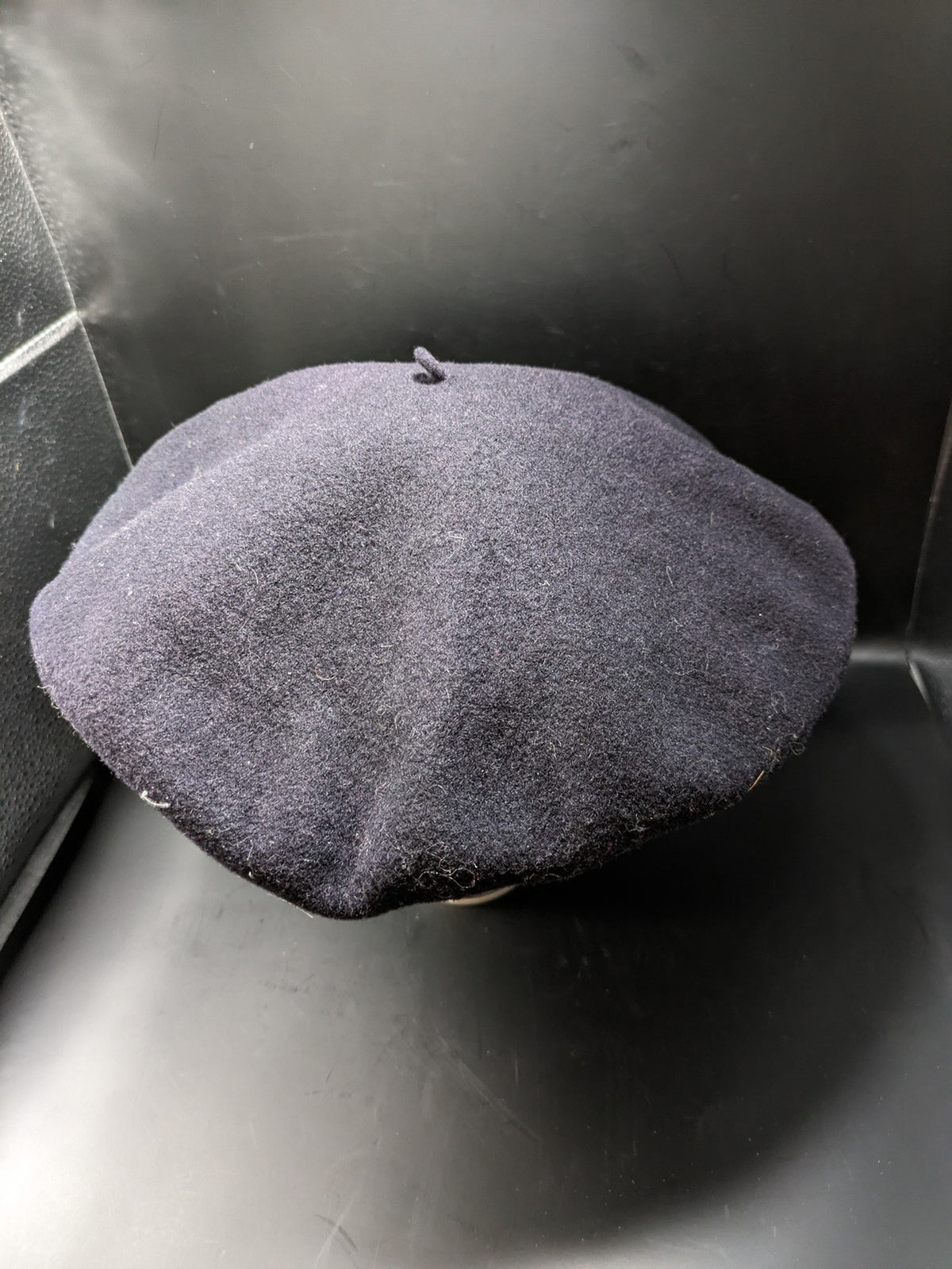 Luxe navy beret pure wool waterproof with emblem lining and leather band.