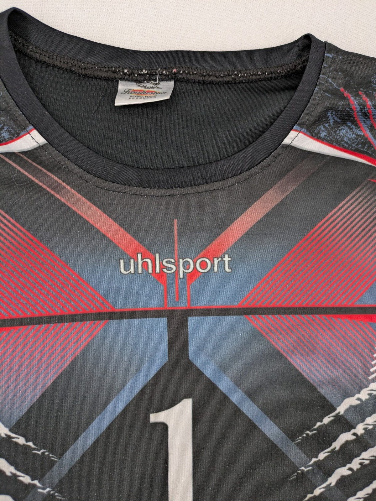 uhlsport long sleeve goalkeeper jersey black with red and blue accents, padded elbows, number 1
