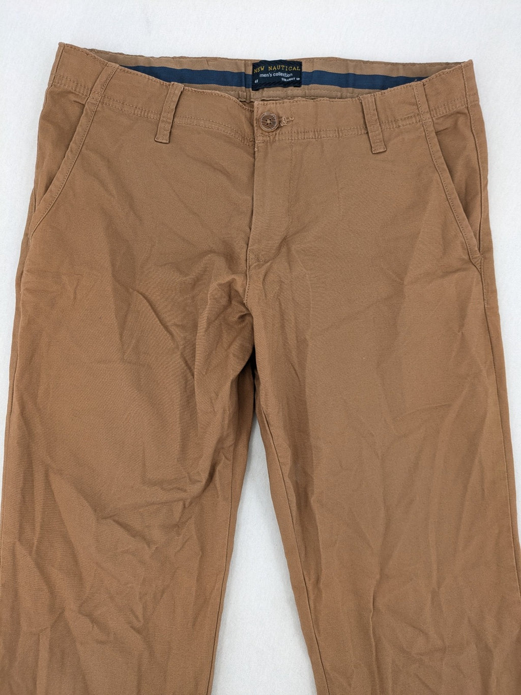 Nautical tan chino pants straight fit cotton blend with subtle anchor print lining.