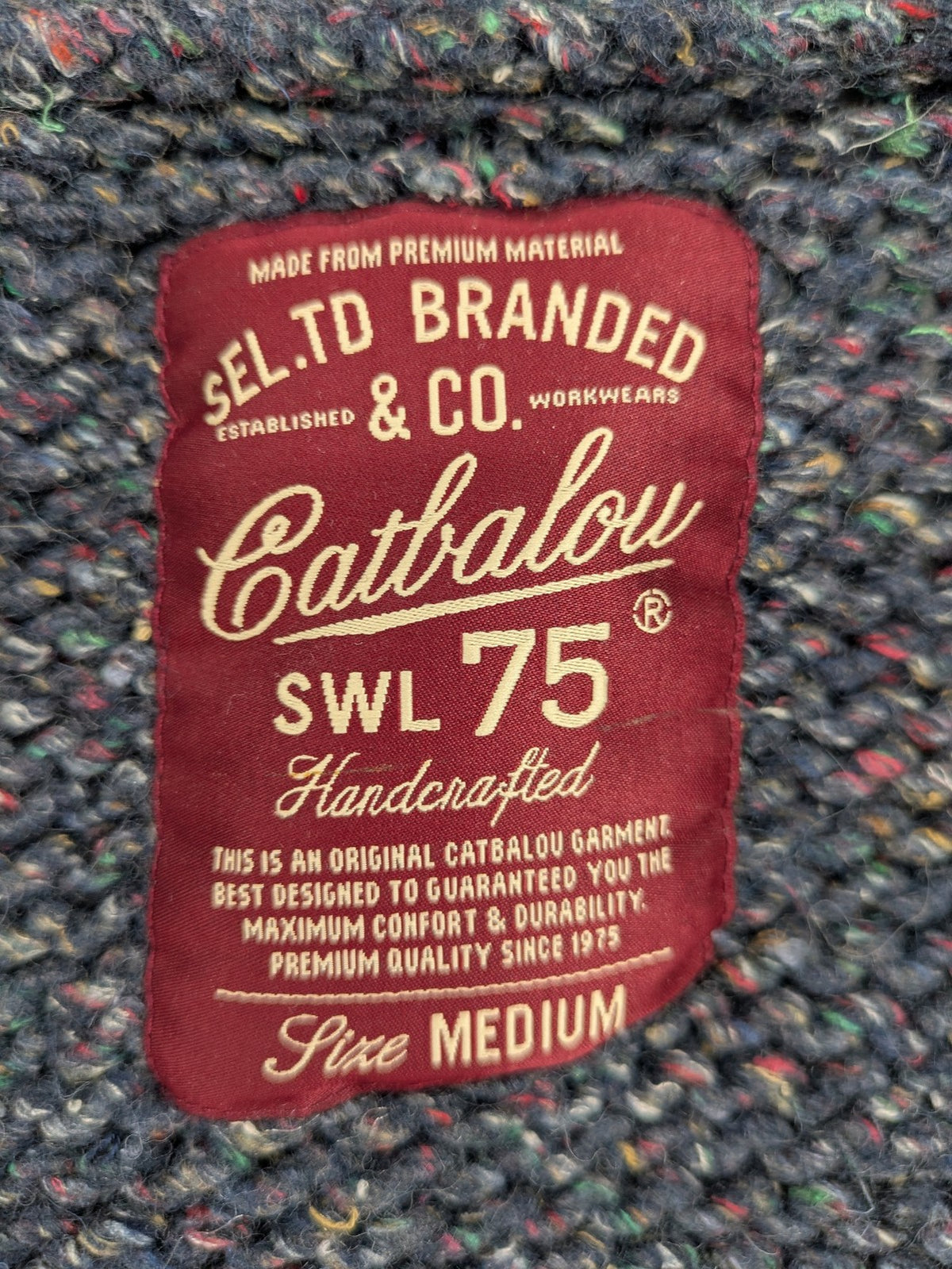 Catbalou multi turtle neck jumper with classic shawl collar and button closure.