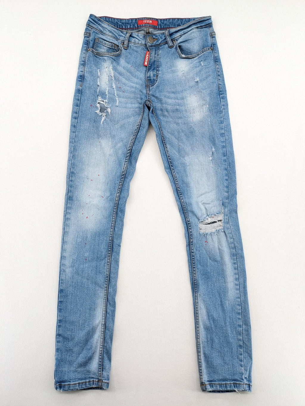 Milano straight jeans light blue distressed with red splatter and extra slim fit.