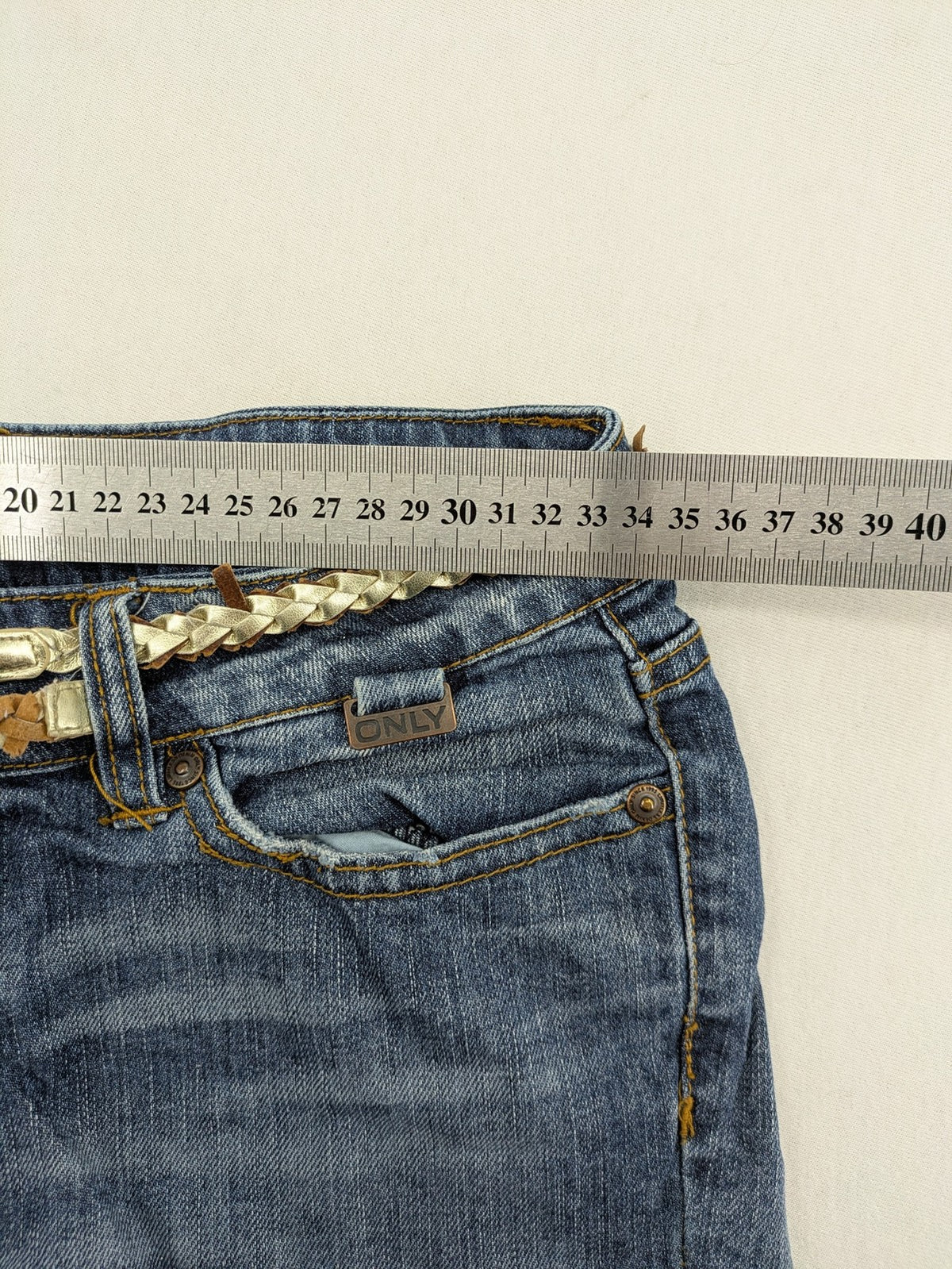ONLY cream denim shorts with frayed hem and decorative braided gold belt