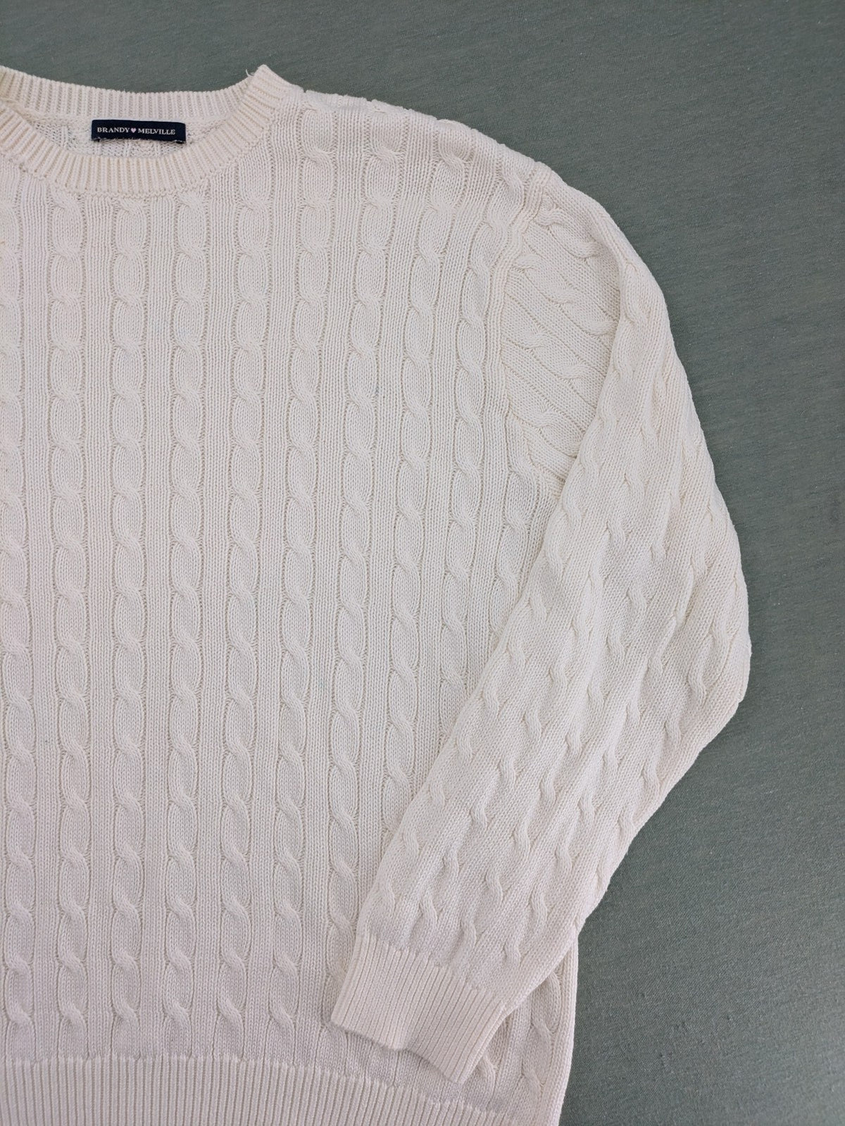 Brandy Melville cream turtle neck jumper with allover cable knit pattern and ribbed hem.
