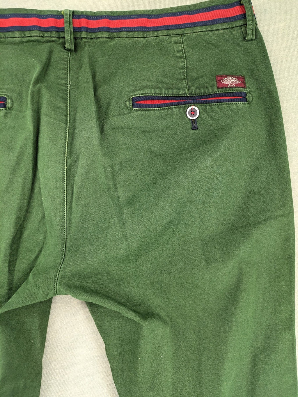 Mason's green chino pants with striped red and blue waistband, cotton stretch material.