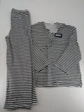 Rubie's costume set black and white striped with prisoner number patch on chest.