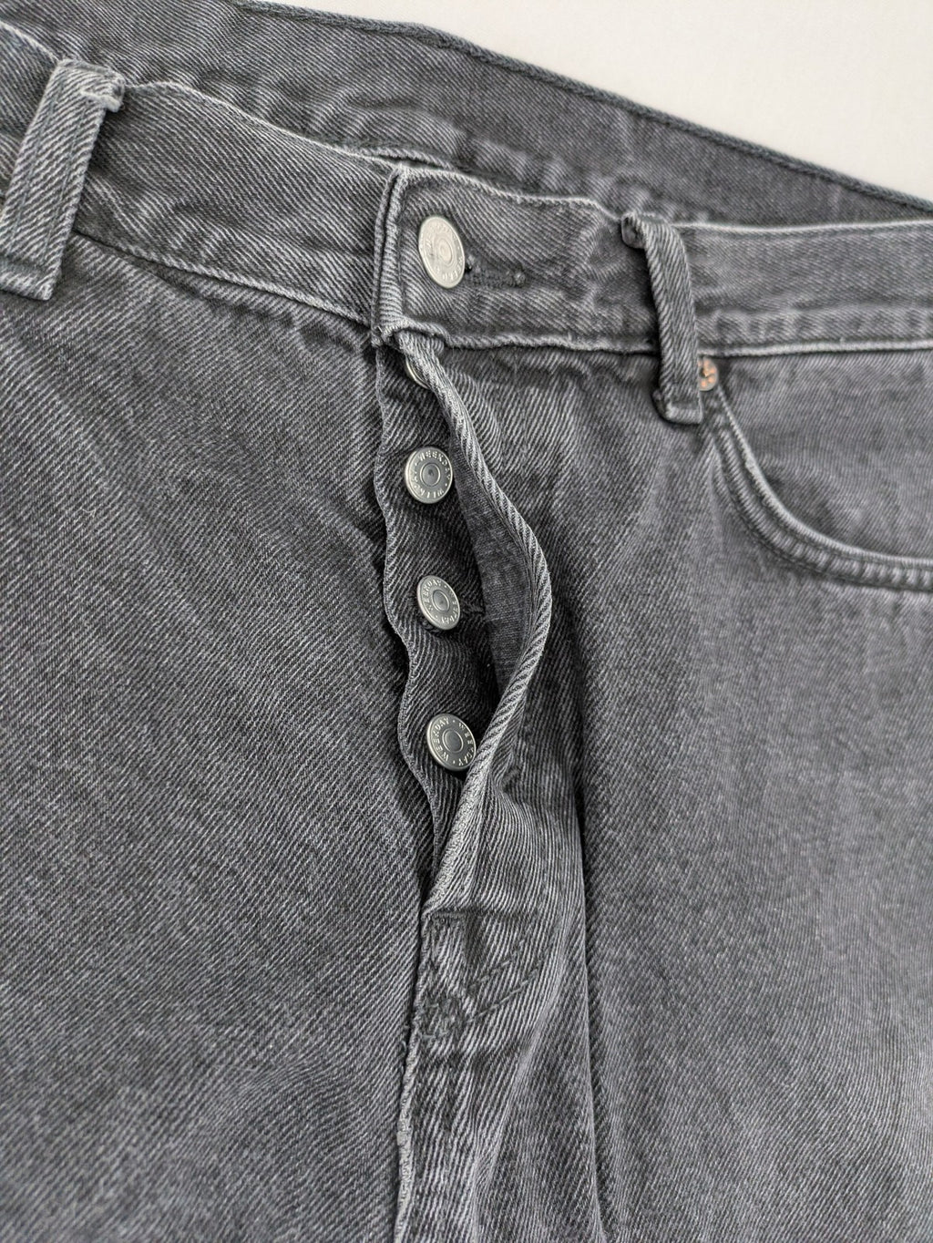 Weekday grey straight jeans washed denim with button fly and classic fit.