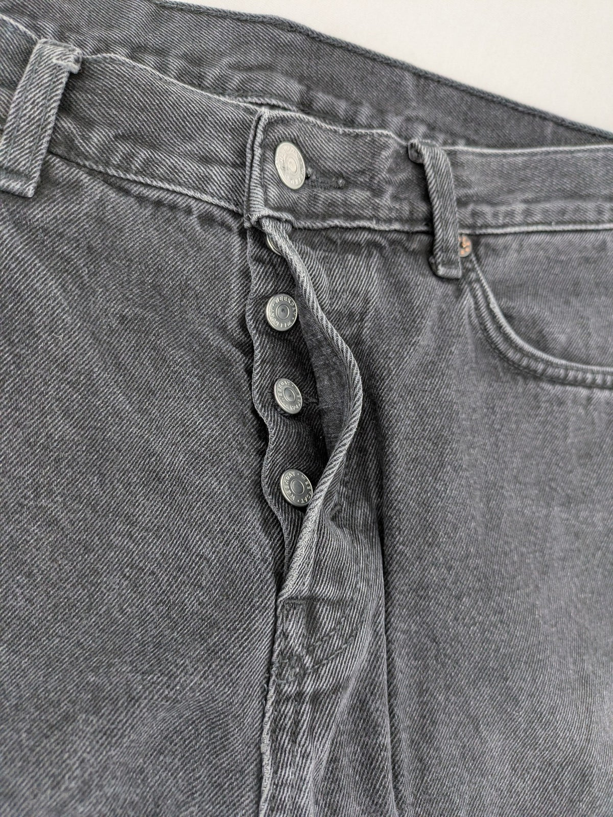 Weekday grey straight jeans washed denim with button fly and classic fit.