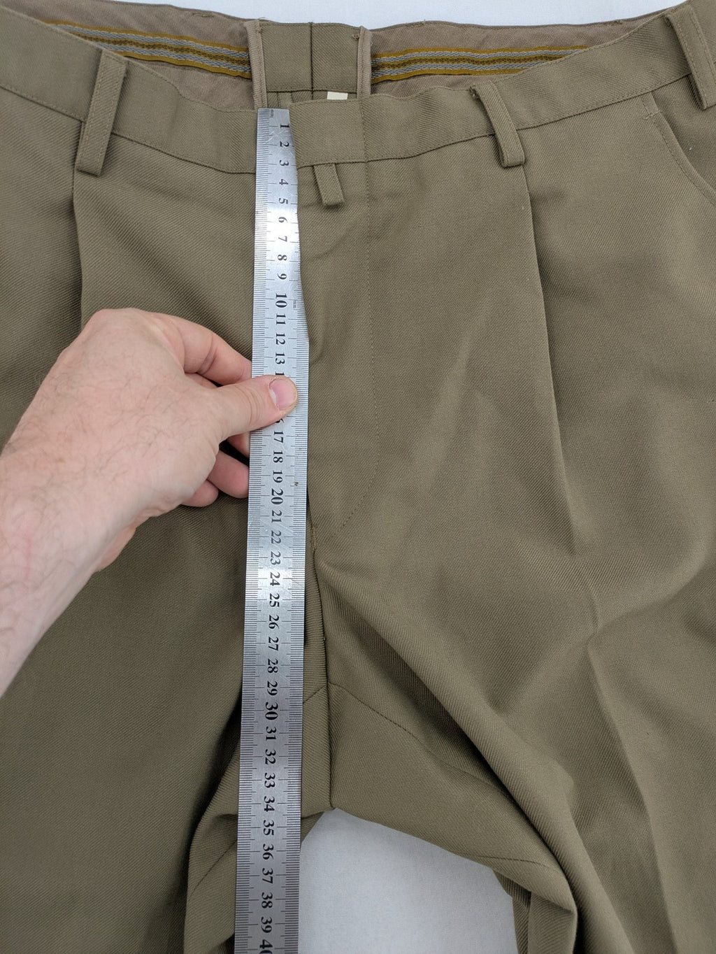 Bundeswehr khaki military uniform trousers with front pleats, zipper, and belt loops.
