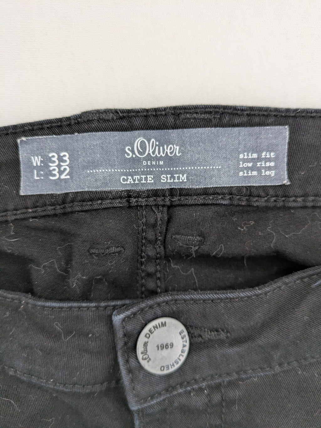 s.Oliver black slim fit jeans with low rise and classic design details.