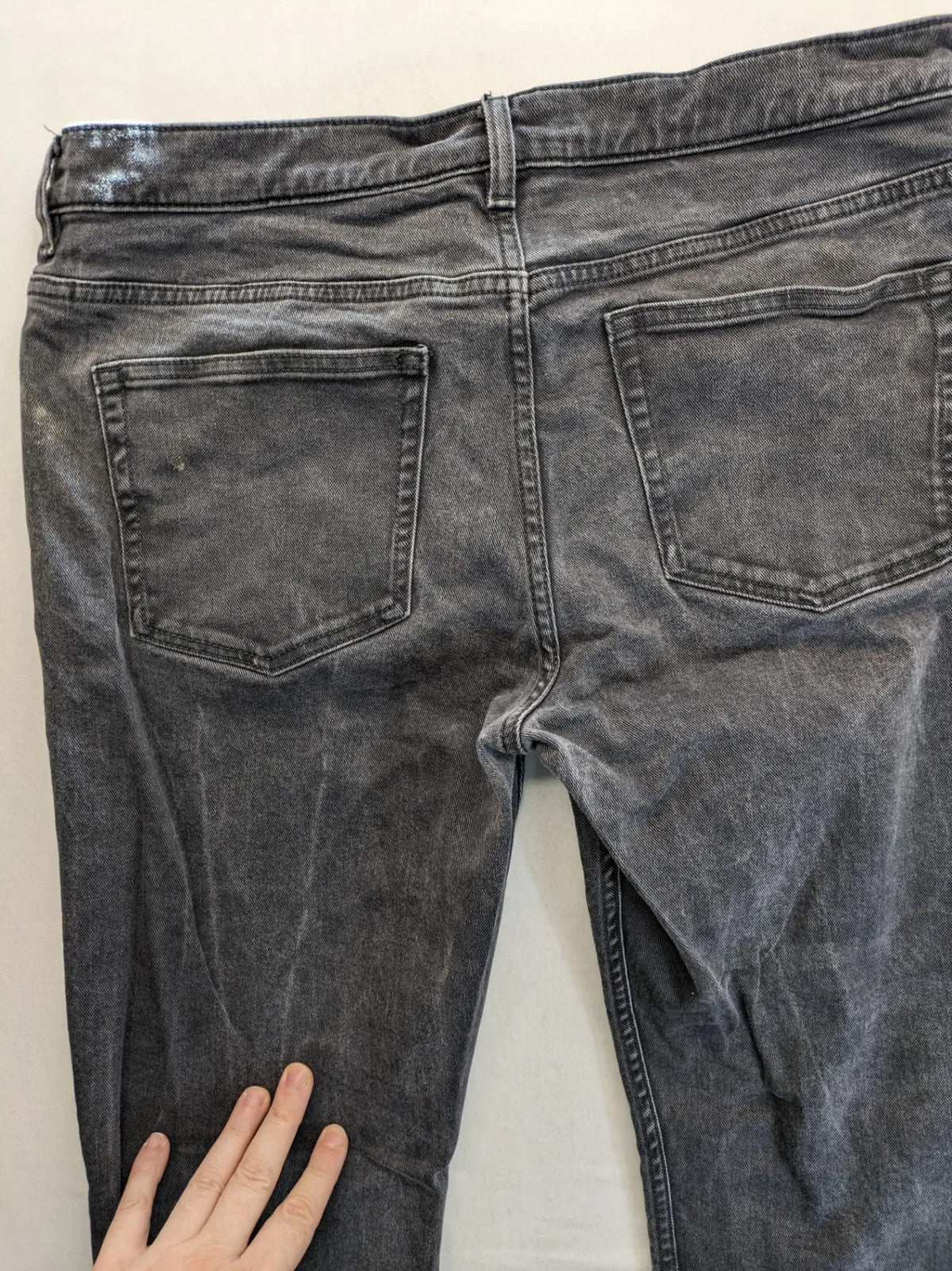 COS grey straight jeans with classic 5-pocket style and washed denim texture.