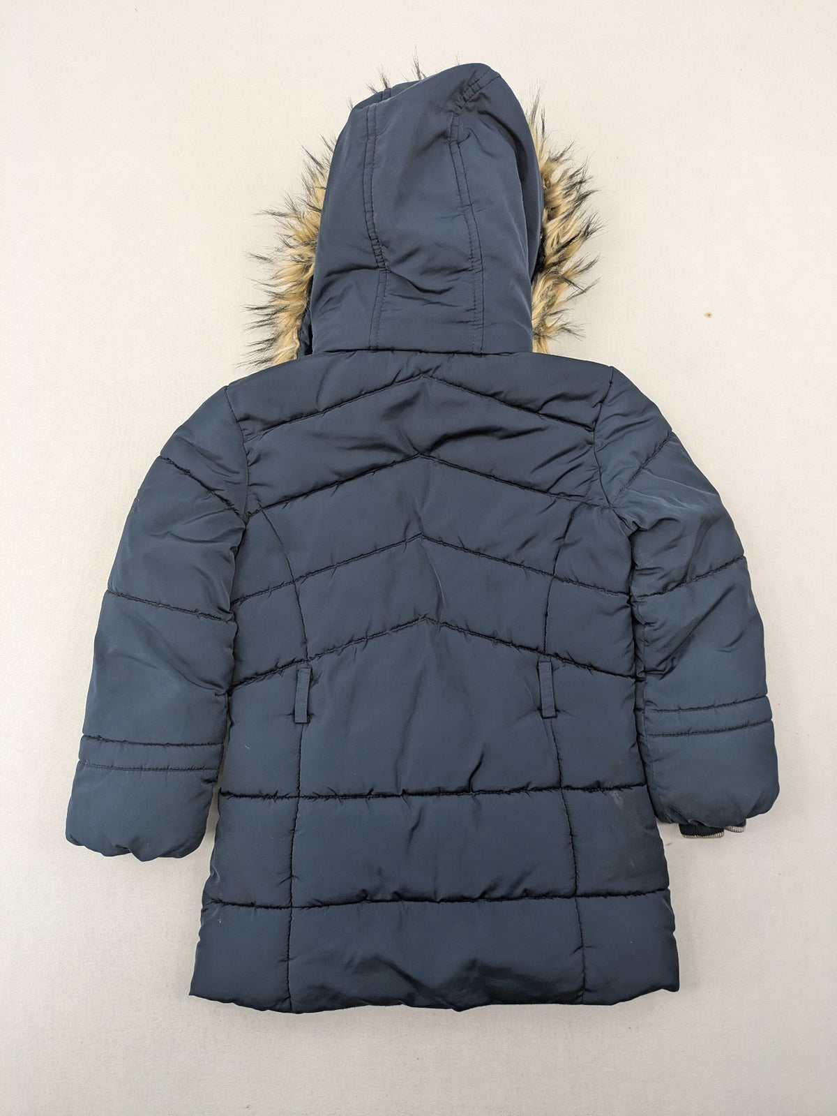 GEF cream coat with quilted design, fleece-lined hood, and faux fur trim.