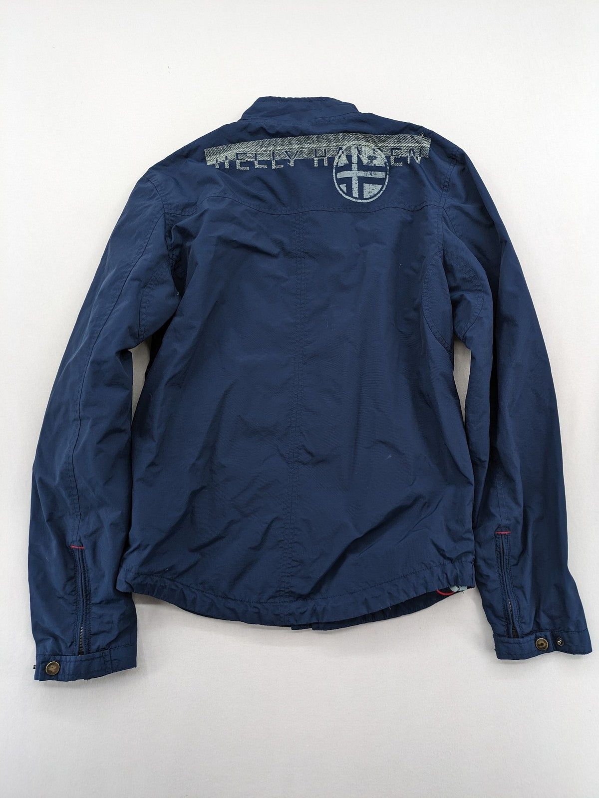Helly Hansen navy jacket with red accents and logo, full zip, breathable mesh lining.