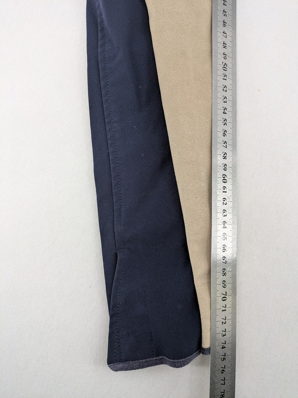 H&KM beige riding pants with dark blue full seat and front zippers.
