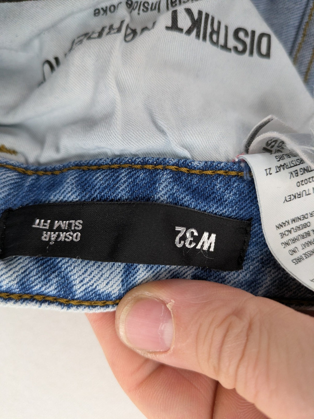 Oskar blue slim fit jeans with classic 5-pocket design and light wash.