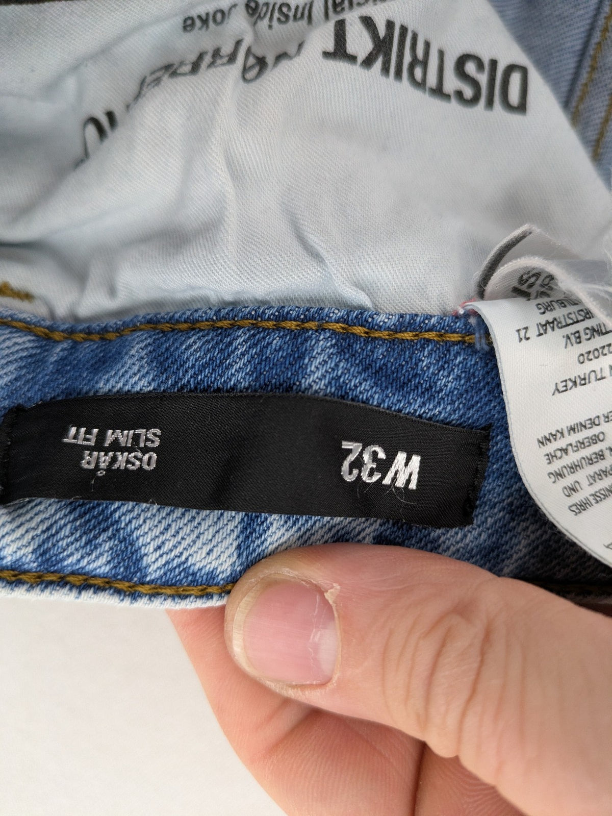 Oskar blue slim fit jeans with classic 5-pocket design and light wash.