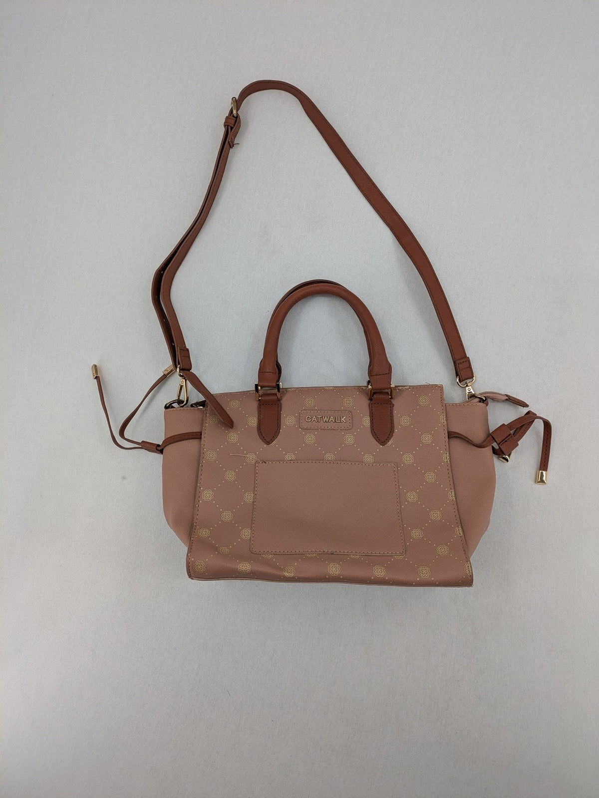 Catwalk gold handbag with pink and brown monogram pattern, adjustable shoulder strap.