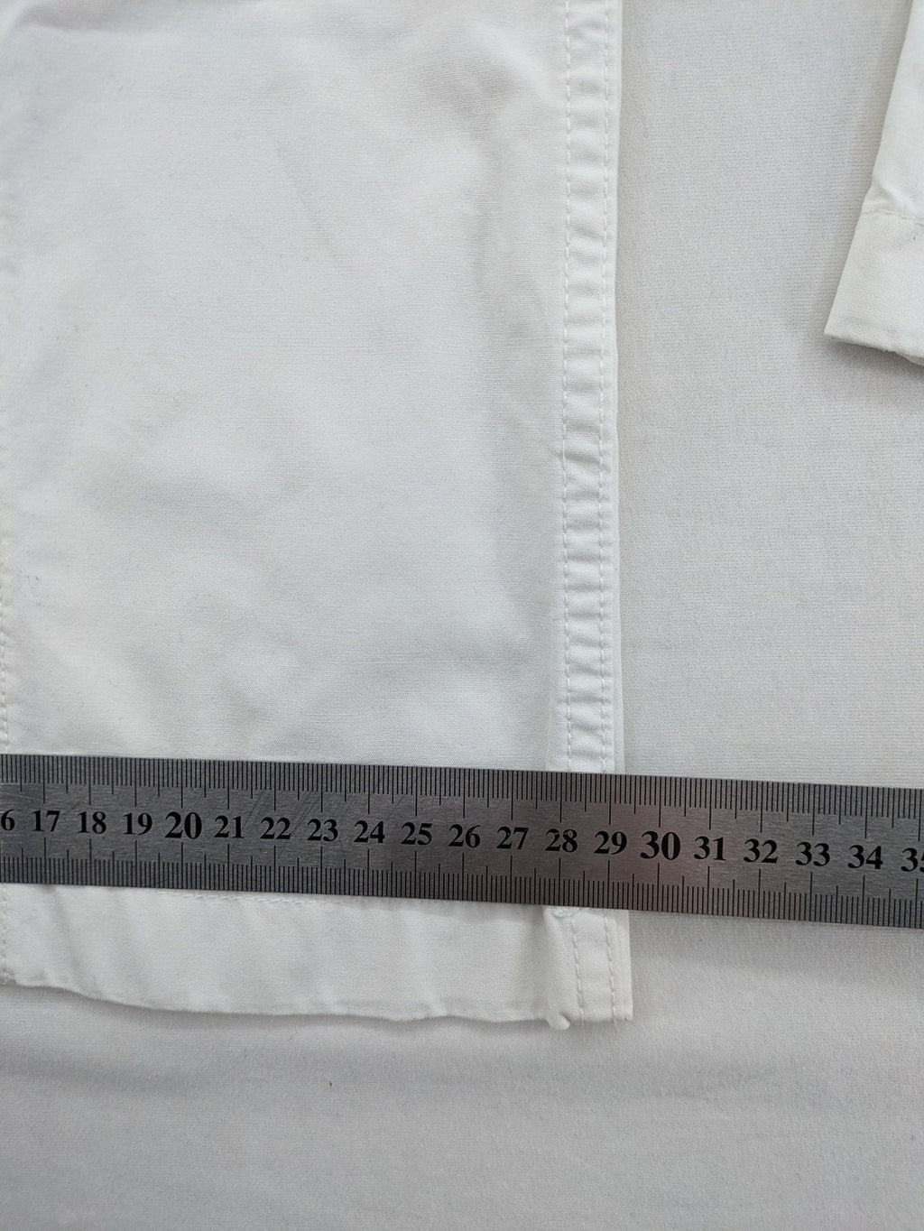 Street One white cargo pants with side pockets and wide leg design.