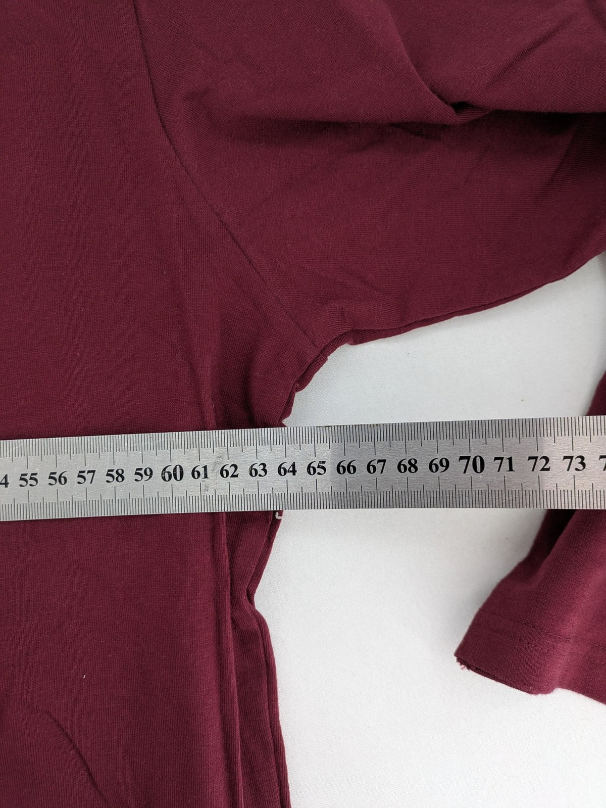 Jan Vanderstorm burgundy Henley shirt with button placket and "087 JV DEPT" graphic print.