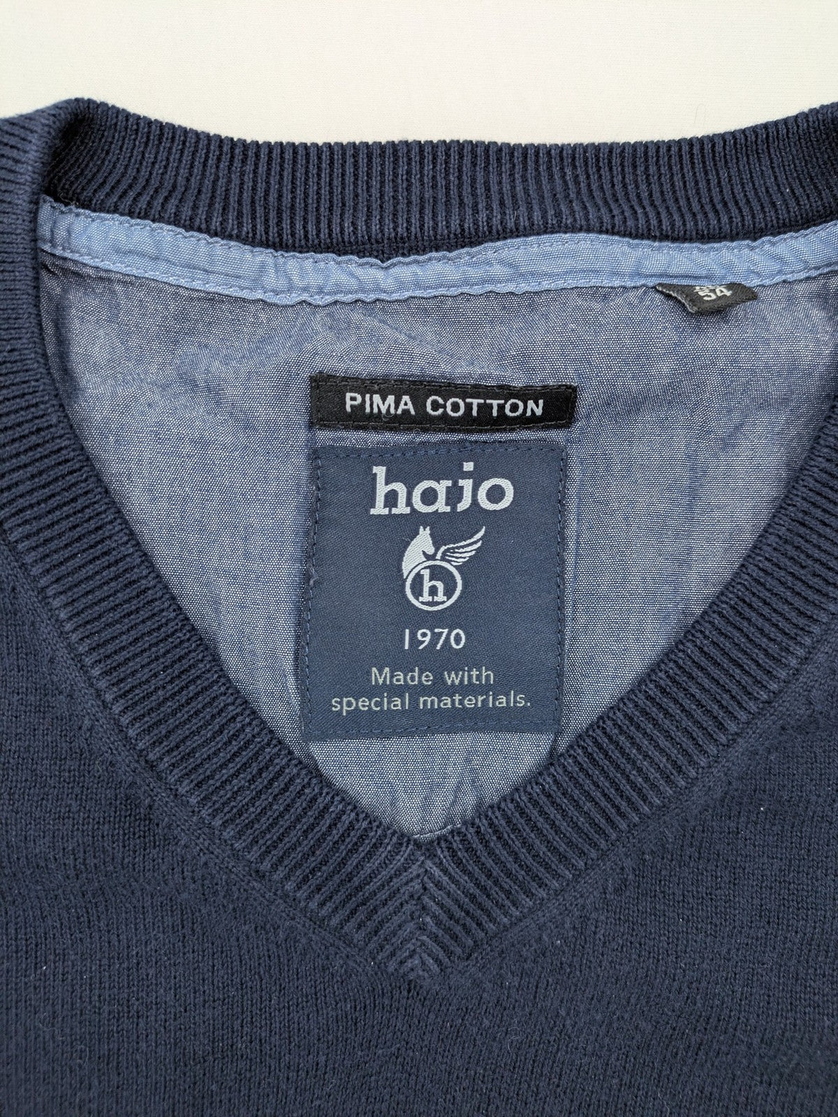 Hajo pink turtle neck jumper with embroidered logo and ribbed cuffs.