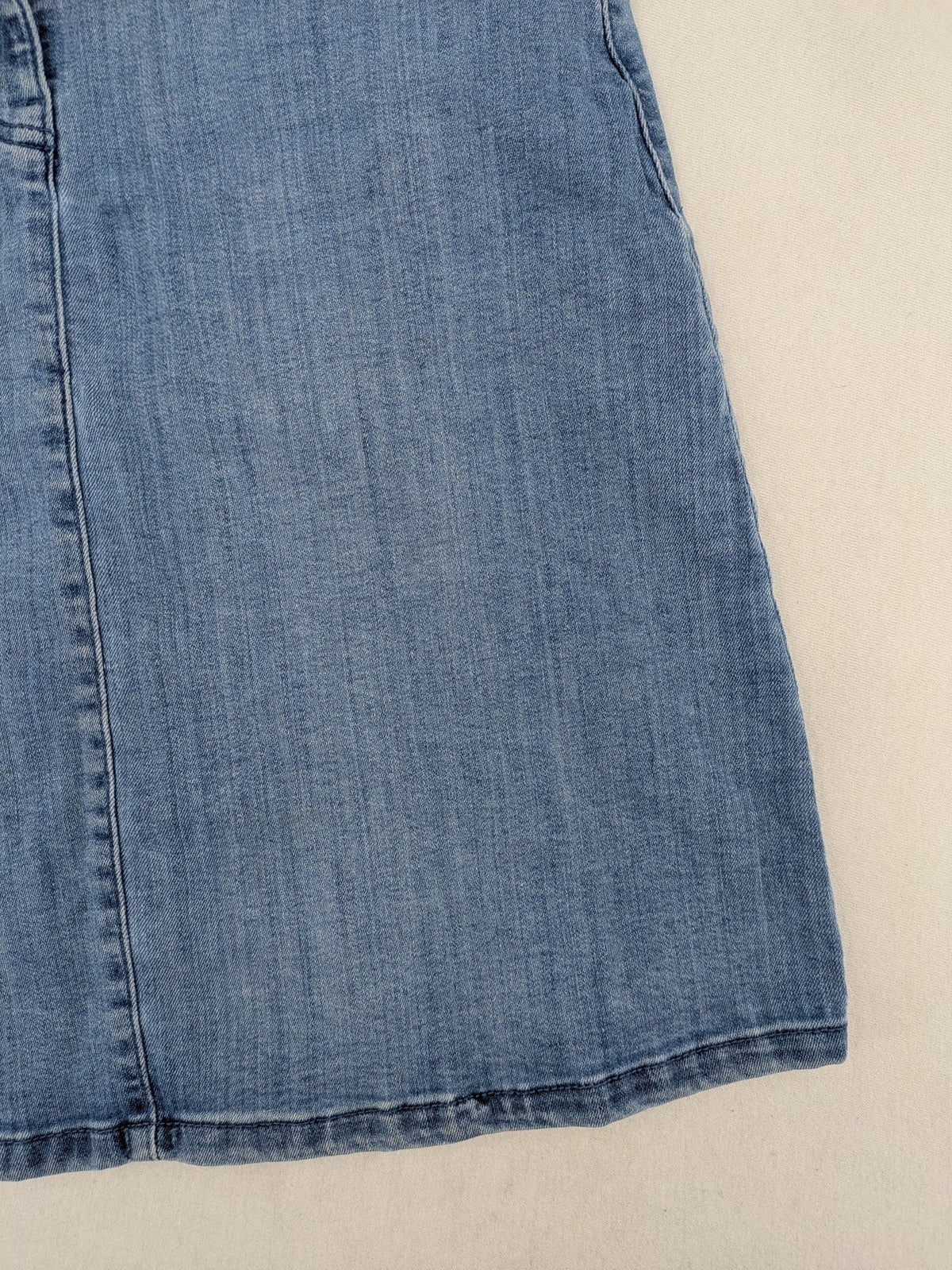 Tchibo blue A-line denim skirt classic five-pocket design with zipper and button closure.