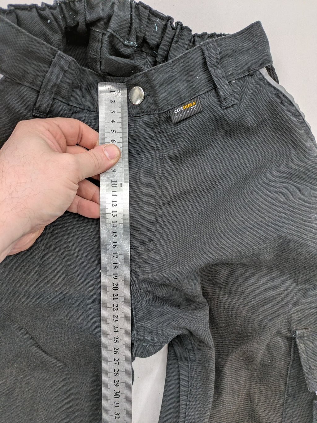 Planam work trousers black canvas with Cordura knee reinforcement and cargo pockets.