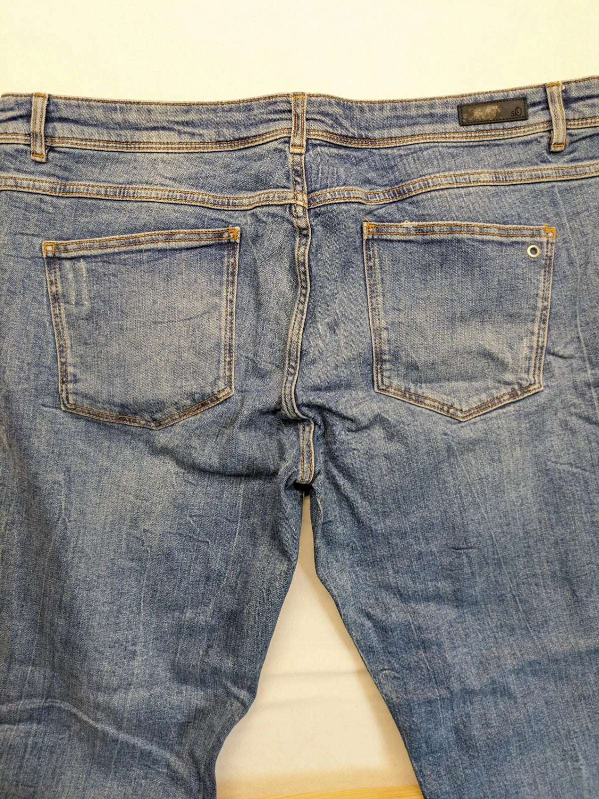 s.Oliver blue straight jeans with red and white side stripes, soft cotton blend material