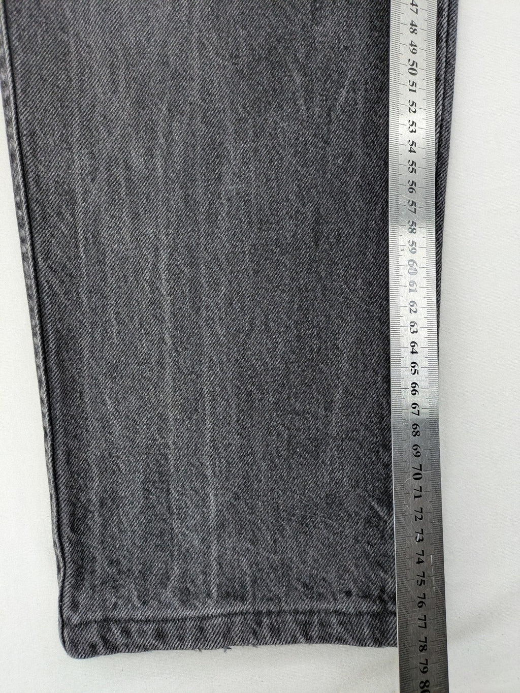 Lucky Star grey tapered high waist jeans with faded wash and red logo details.
