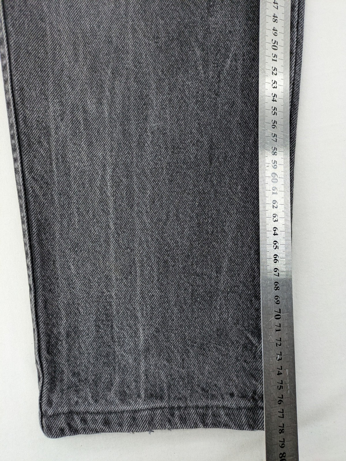 Lucky Star grey tapered high waist jeans with faded wash and red logo details.