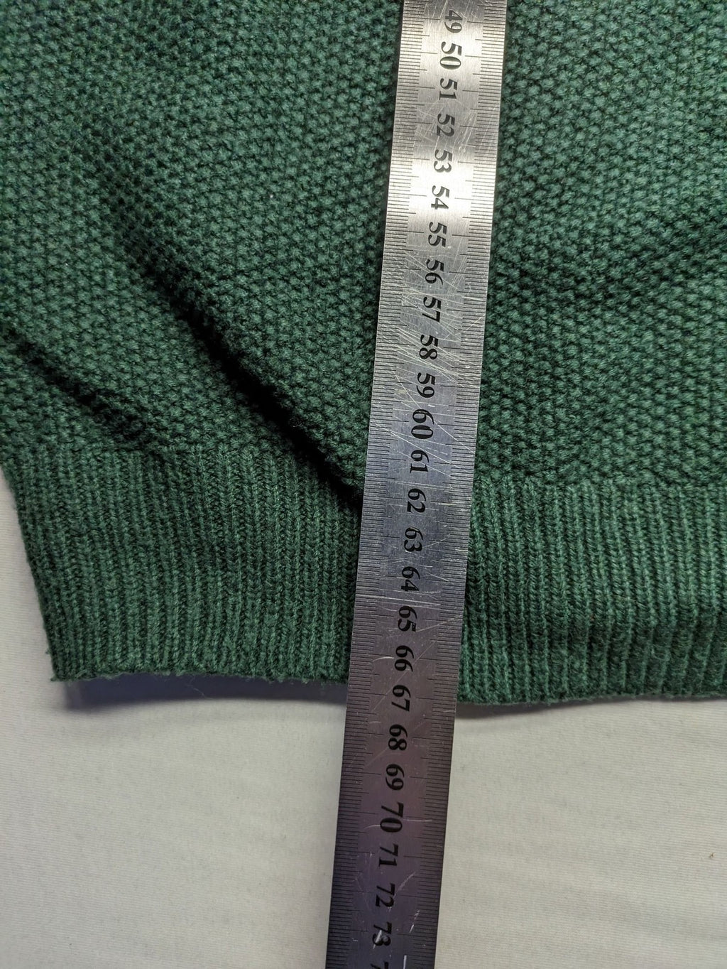 Broken Standard turtle neck jumper green waffle knit texture with classic round neckline.