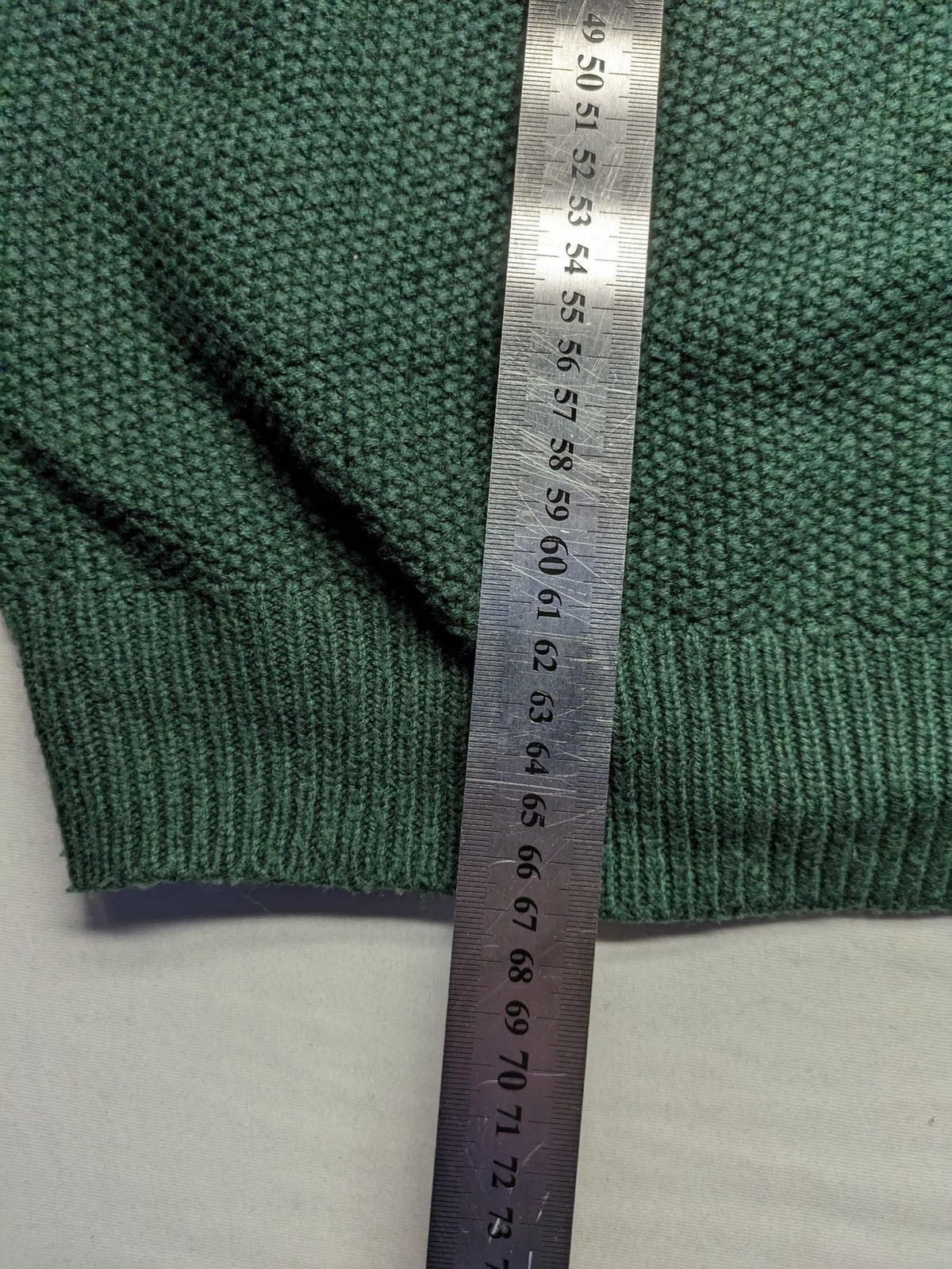 Broken Standard turtle neck jumper green waffle knit texture with classic round neckline.