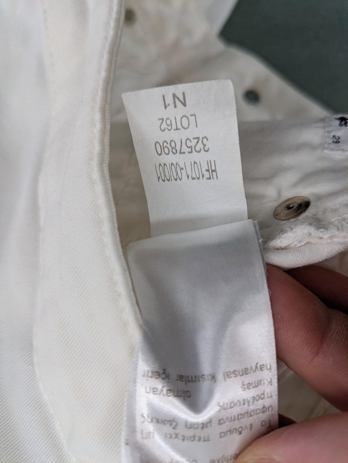 Lacoste white straight jeans high rise slim fit with logo and stretch denim material.