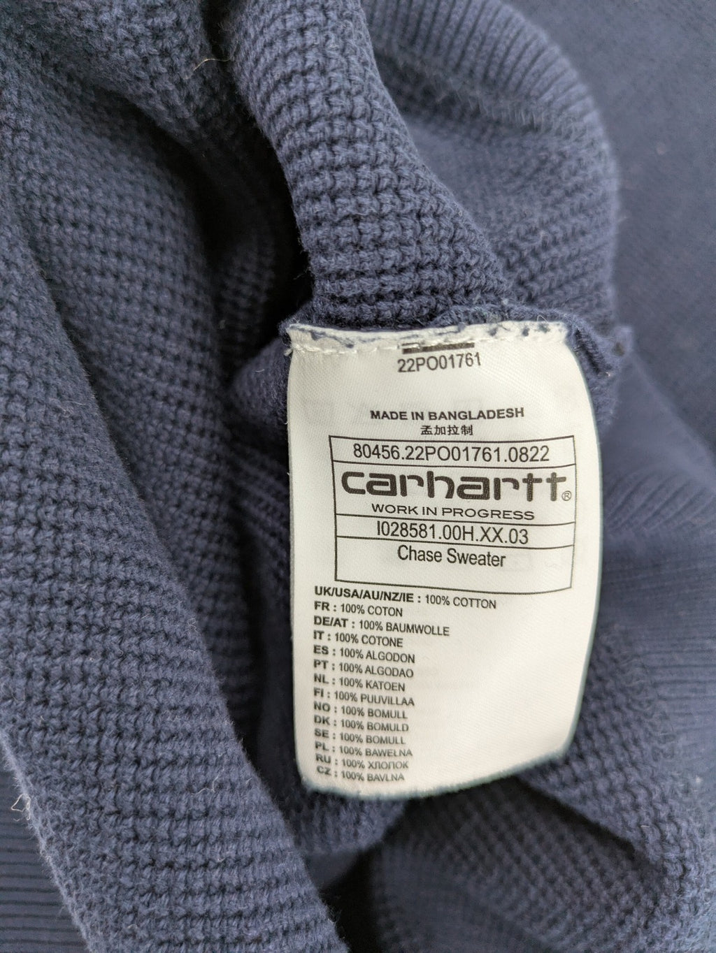 Carhartt navy turtle neck jumper waffle knit texture with subtle logo on sleeve.