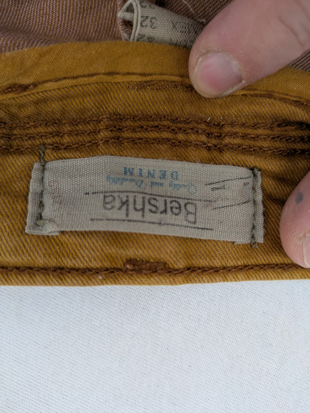 Bershka brown straight jeans slim fit classic 5-pocket design with prominent stitching.