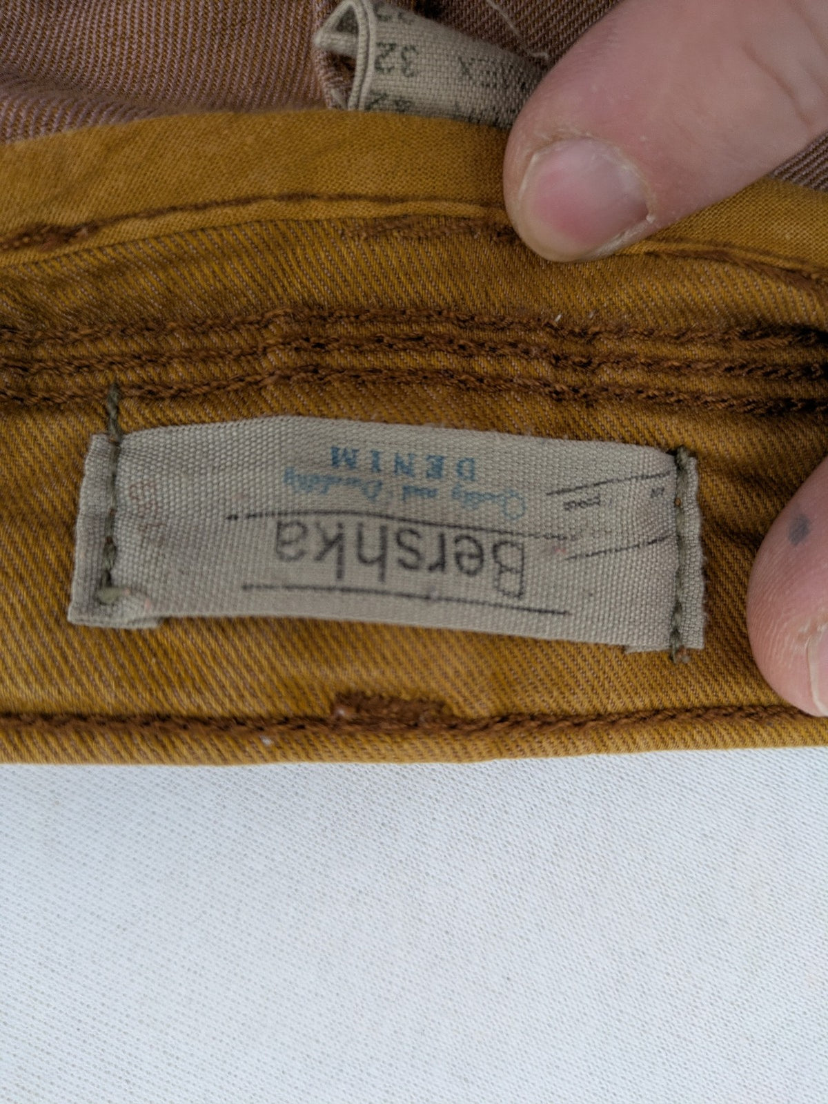 Bershka brown straight jeans slim fit classic 5-pocket design with prominent stitching.