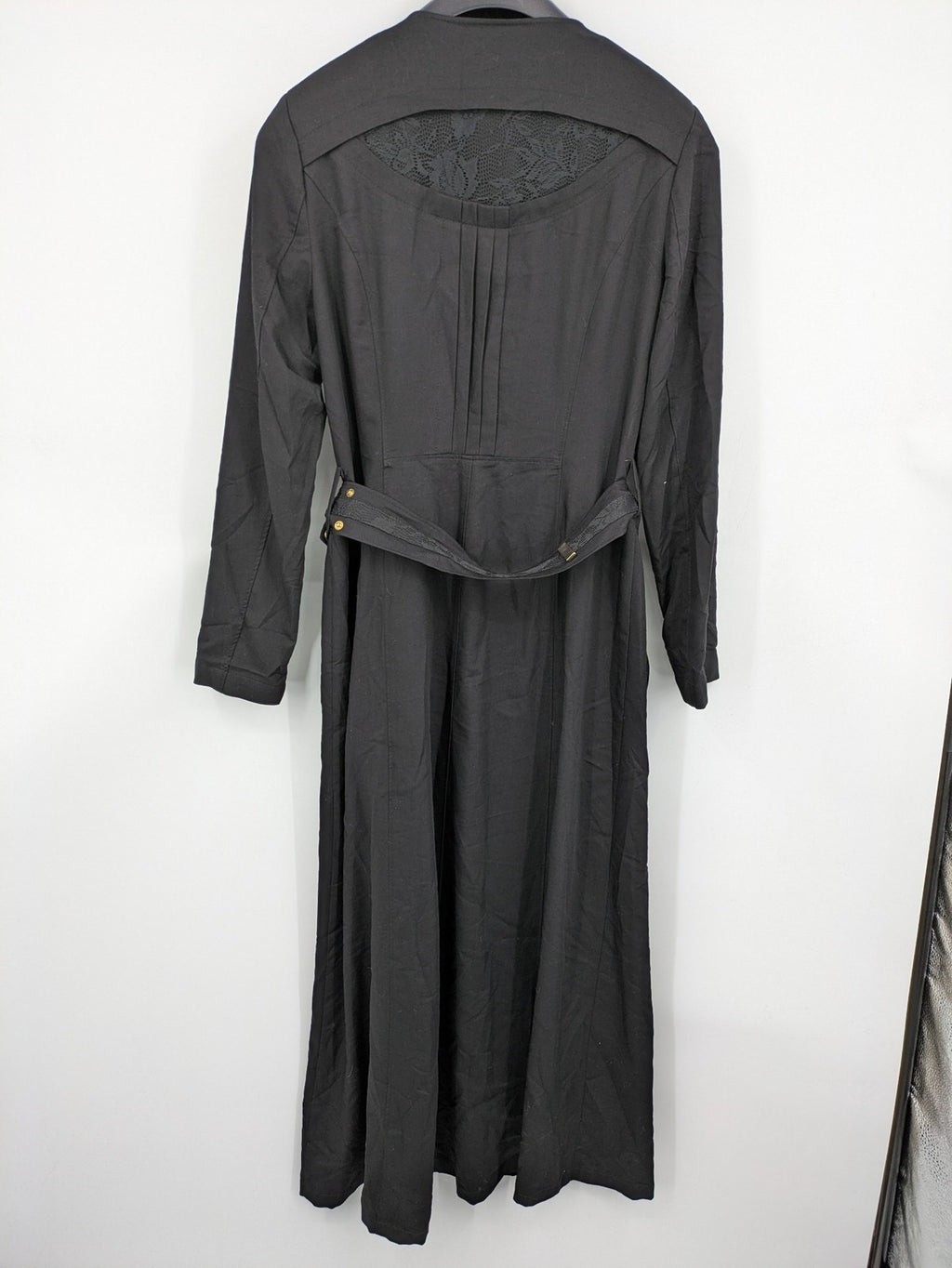 Alvina black trench coat with lace collar and gold buttons, belted waist design.
