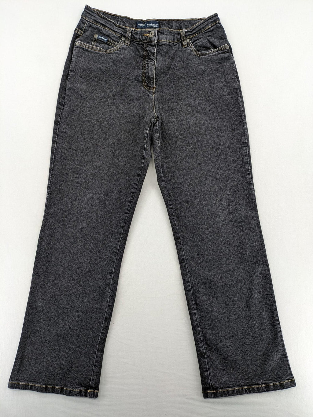 Bootcut grey low rise bootcut jeans five-pocket design with zipper and button closure.