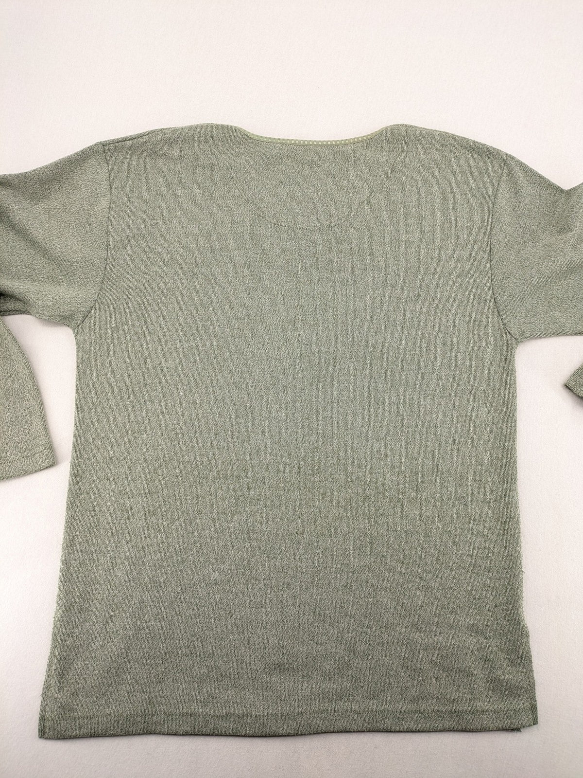 NOSCH knit jumper grey textured fabric with embroidered logo and subtle rhinestone accents.
