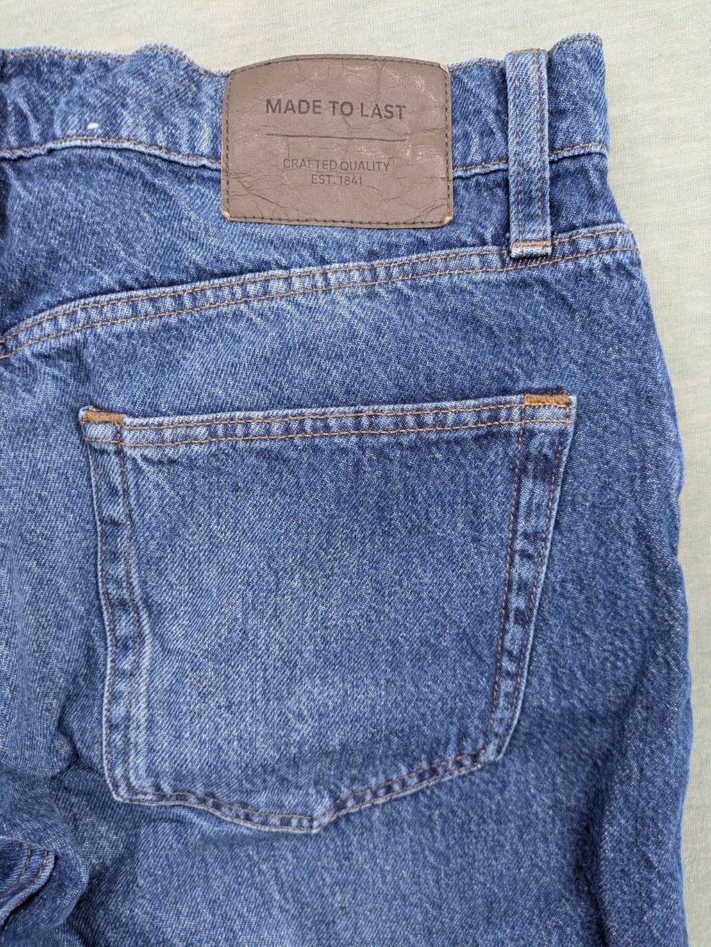 C&A blue straight jeans relaxed fit with traditional button fly and 5-pocket design.