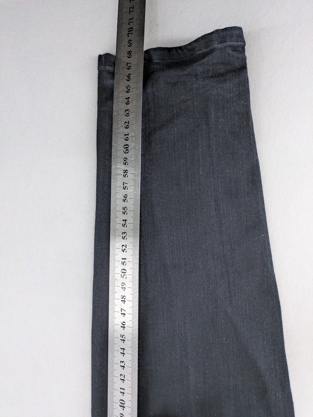 H&M grey skinny jeans with faded wash and soft stretch denim material.