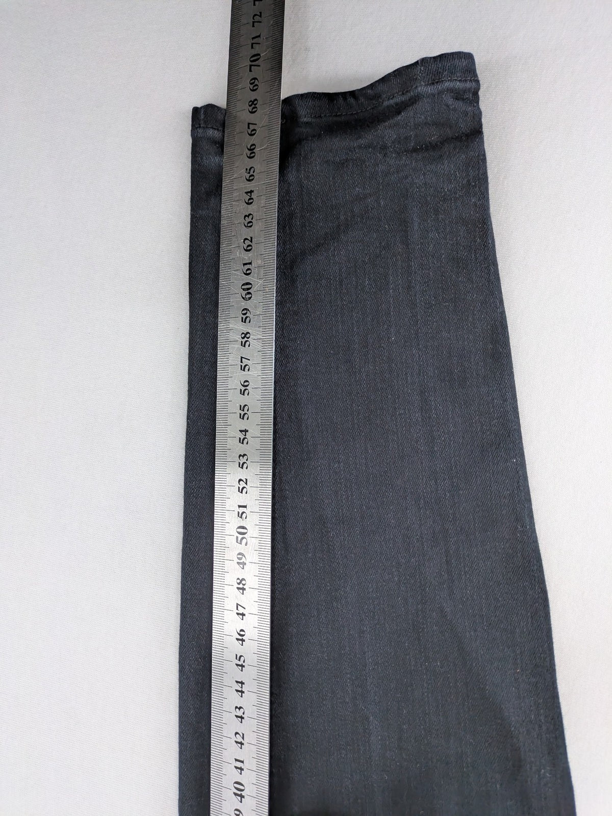 H&M grey skinny jeans with faded wash and soft stretch denim material.