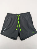 Crivit black running shorts with neon green accents, elastic waistband, and reflective details.